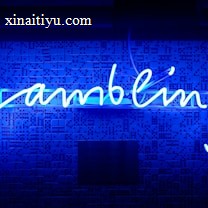 A bright blue neon sign spells out the word 'gambling' in cursive script. The background features a textured wall covered in domino tiles, also illuminated by the blue light, creating a vivid and visually striking scene.